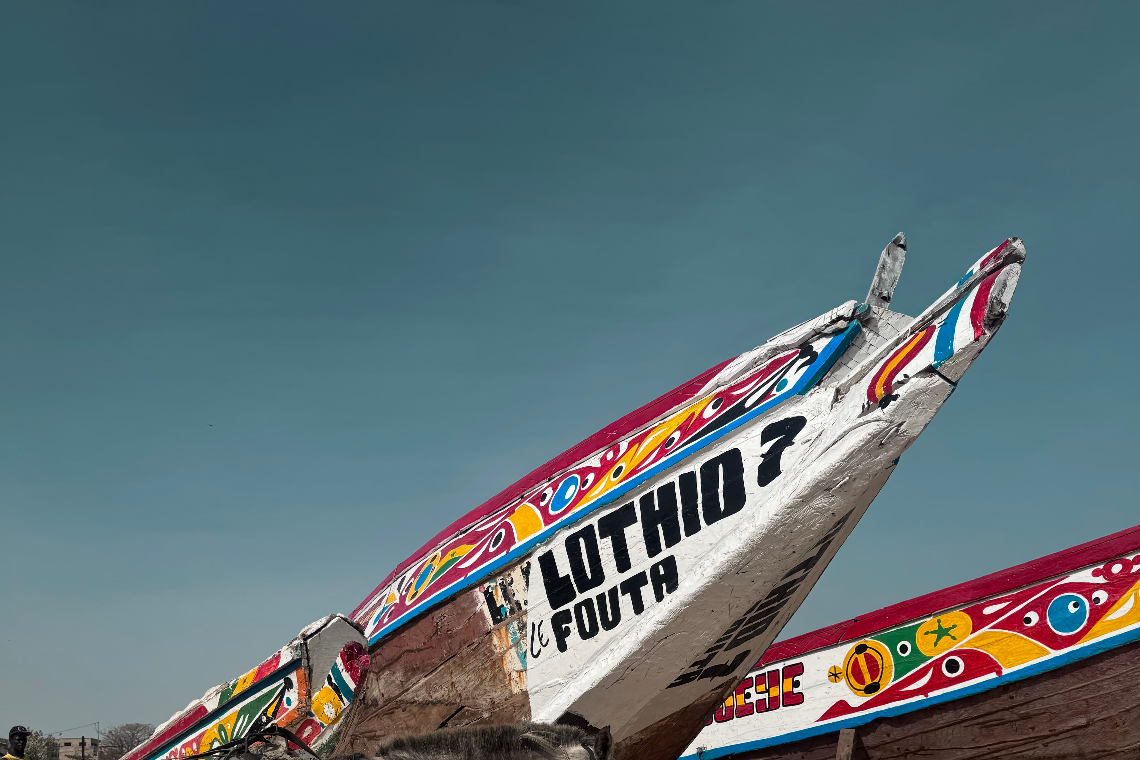 Painted fishing boats on the Dakar coast